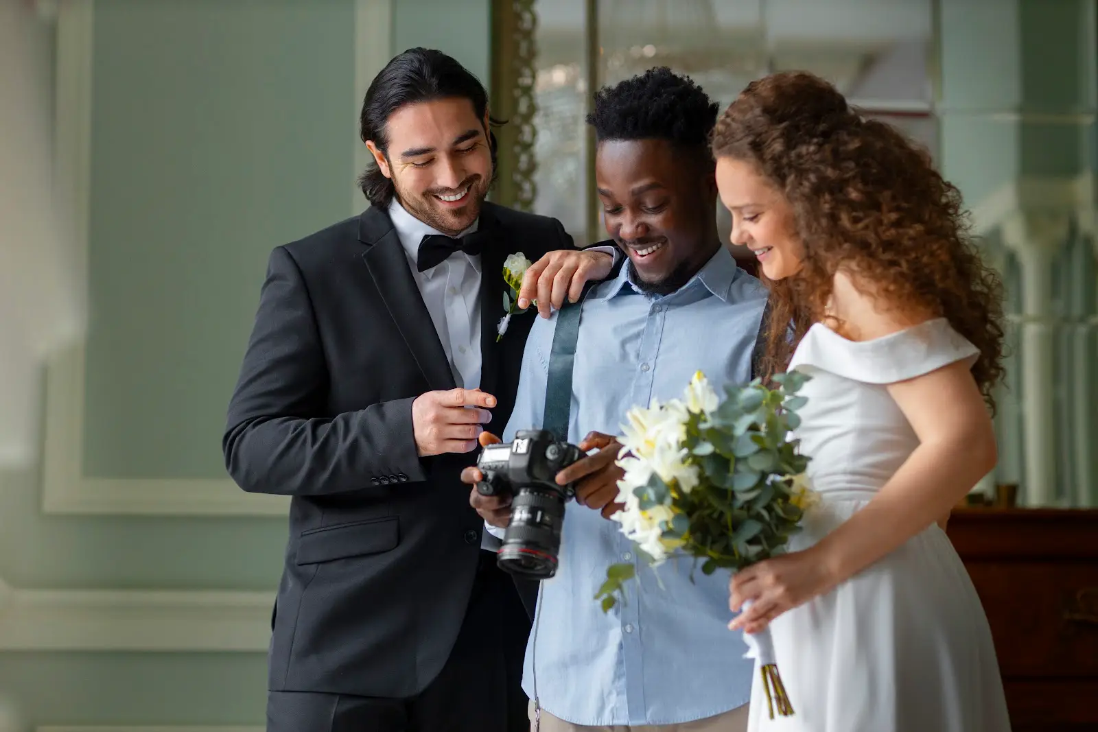 Photographer showing a sample shot to the happy couple during a wedding raffle prize session at their venue.
