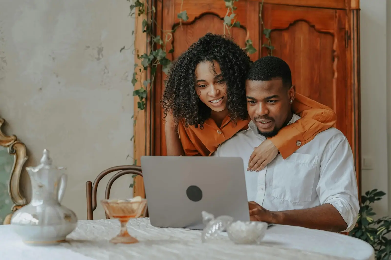 Couple researching a legit wedding competition online at home