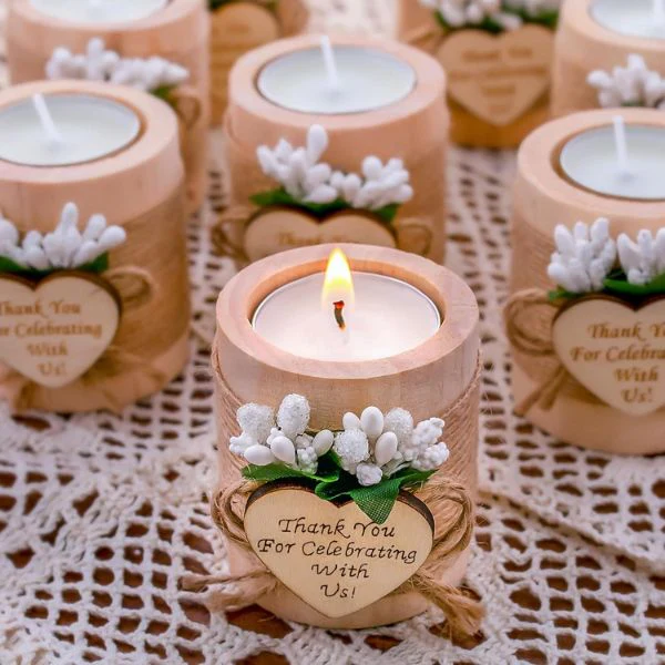 Small candle holders with "Thank You" tags, offered as keepsakes that further personalise your wedding.