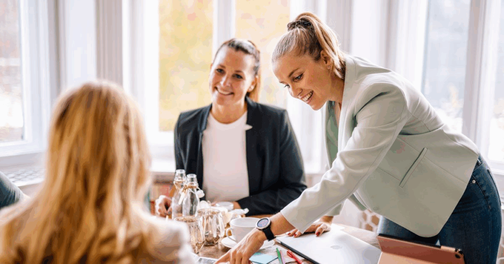 A wedding planner engaged in a consultation with two clients, illustrating the detailed decision-making process for choosing between a "Wedding Planner and Wedding Coordinator"